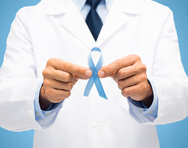 Healthcare provider holding prostate cancer awareness ribbon