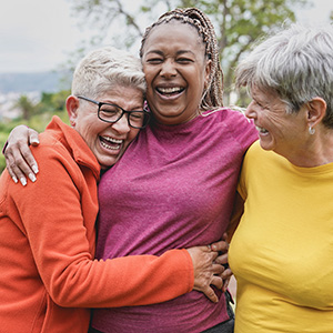 Adults embracing during community gathering
