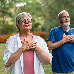Adults embracing during community gathering